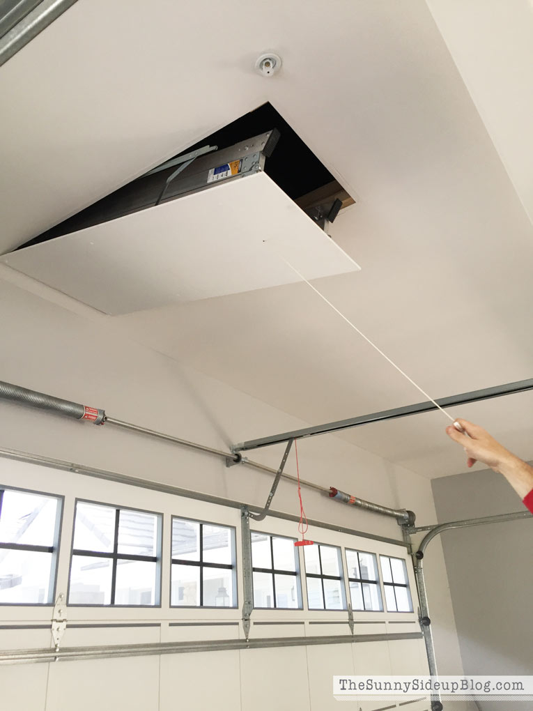 hidden-garage-storage-with-built-in-ladder