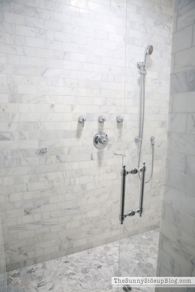 https://www.thesunnysideupblog.com/wp-content/uploads/2017/03/Carrara-Marble-Bathroom-Tile-Sunny-Side-Up.jpg