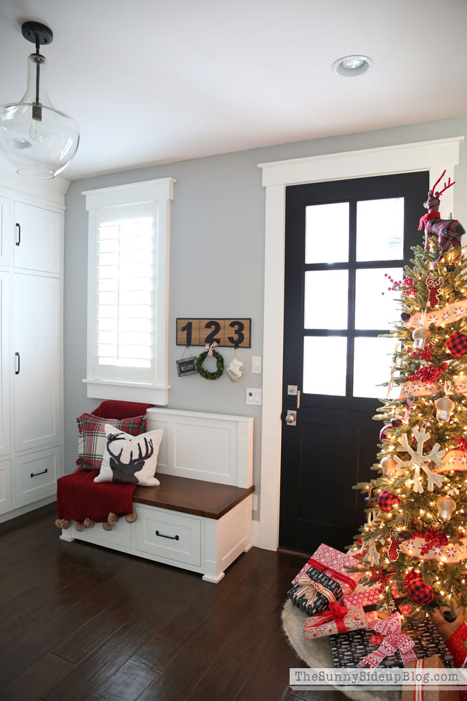 Black dutch door - mudroom with built in cabinets decked for Christmas! 